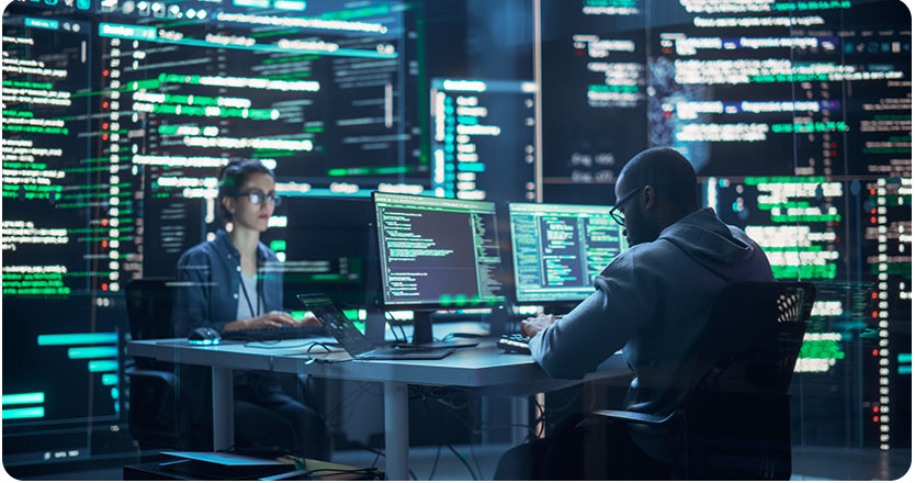 Portrait of Two Programmers Working in a Monitoring Control Room, Surrounded by Big Screens Displaying Lines of Programming Language Code. Portrait of Diverse Developers Creating a Software and Coding